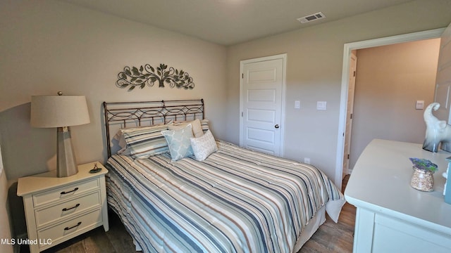 bedroom featuring dark hardwood / wood-style floors