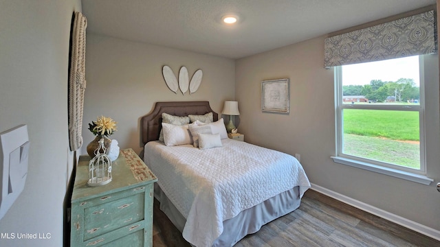 bedroom featuring hardwood / wood-style floors