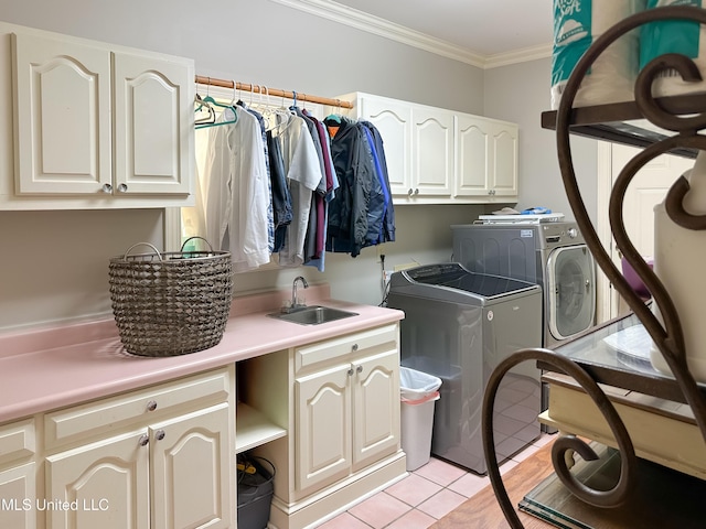 1120 Ford Rd, Terry, MS 39170 - laundry area with cabinet space, washing machine and clothes dryer, crown molding, and light tile patterned floors