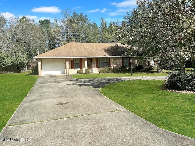 single story home featuring a garage and a front yard