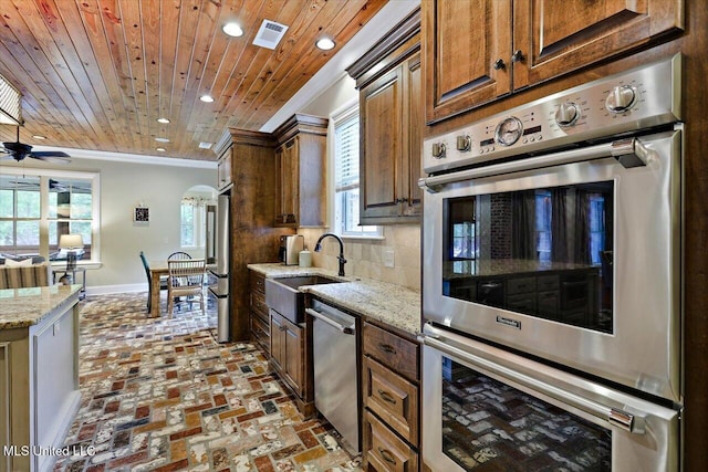 kitchen with crown molding, tasteful backsplash, visible vents, wooden ceiling, and appliances with stainless steel finishes