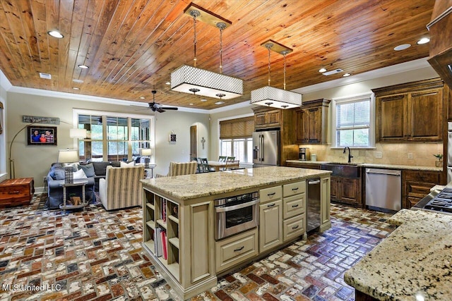 kitchen with ornamental molding, brick floor, appliances with stainless steel finishes, and wood ceiling