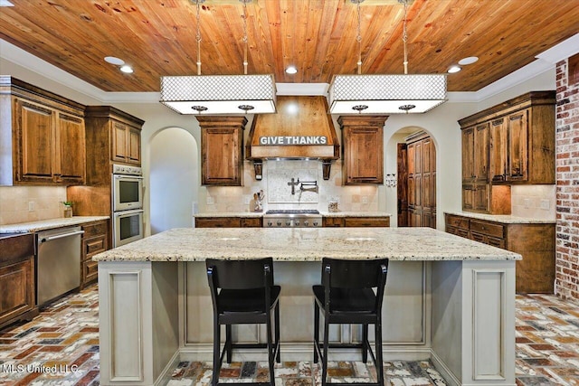 kitchen with brick floor, appliances with stainless steel finishes, arched walkways, and wood ceiling