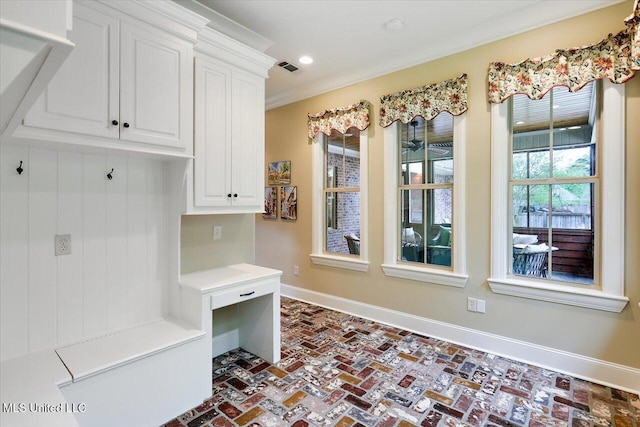 mudroom featuring recessed lighting, brick floor, baseboards, and visible vents