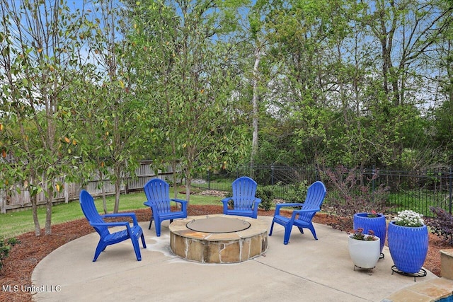 view of patio / terrace featuring a fenced backyard and a fire pit