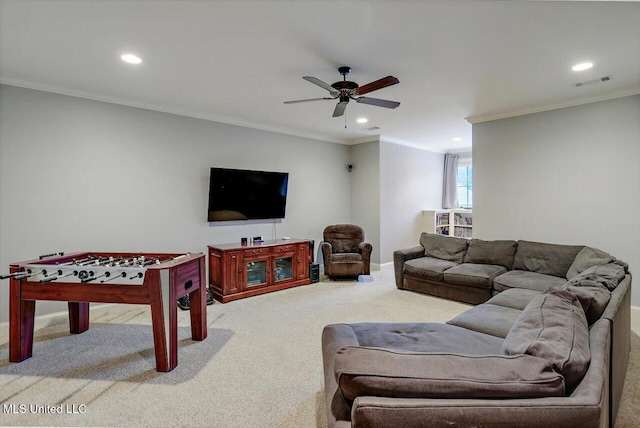 living area featuring visible vents, a ceiling fan, crown molding, and carpet floors