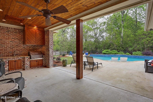 view of patio featuring an outdoor pool, grilling area, and ceiling fan