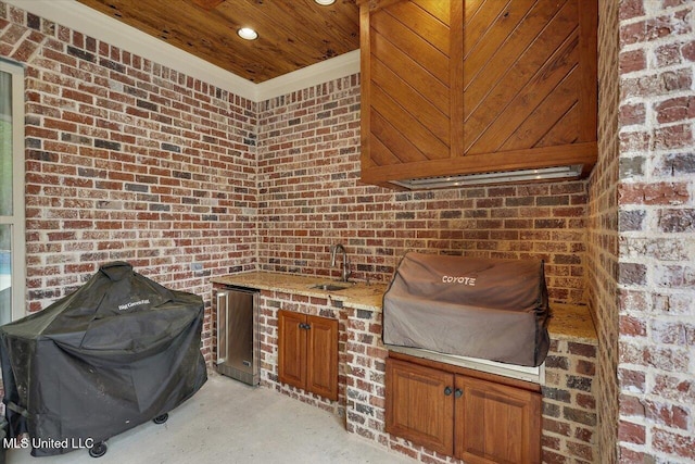 view of patio with a sink and area for grilling