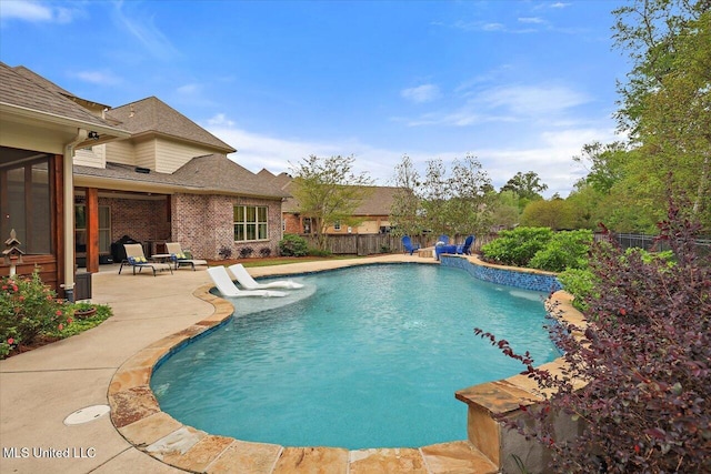 view of swimming pool with a fenced in pool, a patio area, and a fenced backyard