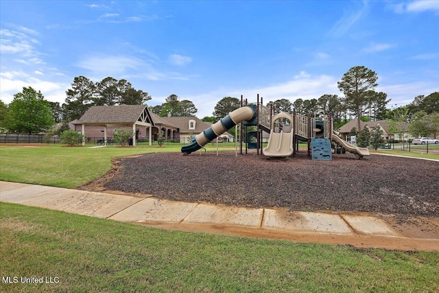 community playground featuring a lawn
