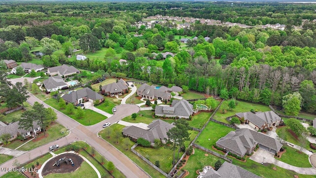 birds eye view of property featuring a residential view and a forest view
