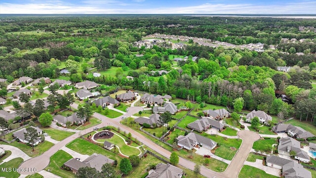 bird's eye view featuring a view of trees and a residential view