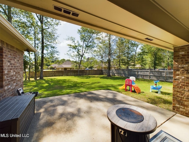 view of patio / terrace featuring a fire pit