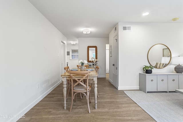 dining area featuring hardwood / wood-style floors