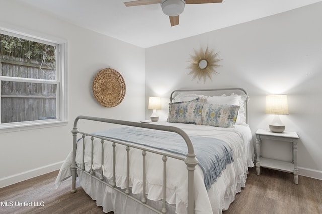 bedroom with dark wood-type flooring and ceiling fan