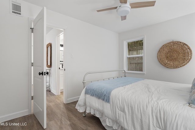 bedroom featuring dark wood-type flooring and ceiling fan