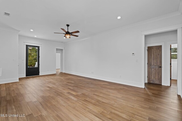 unfurnished living room featuring ornamental molding, light hardwood / wood-style floors, and ceiling fan