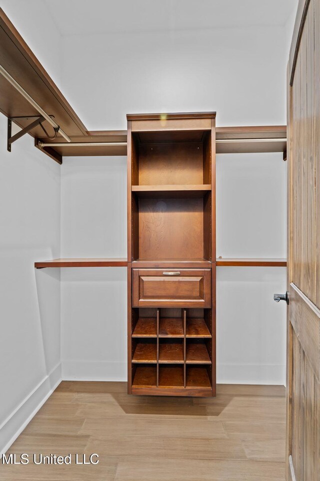 walk in closet featuring light wood-type flooring