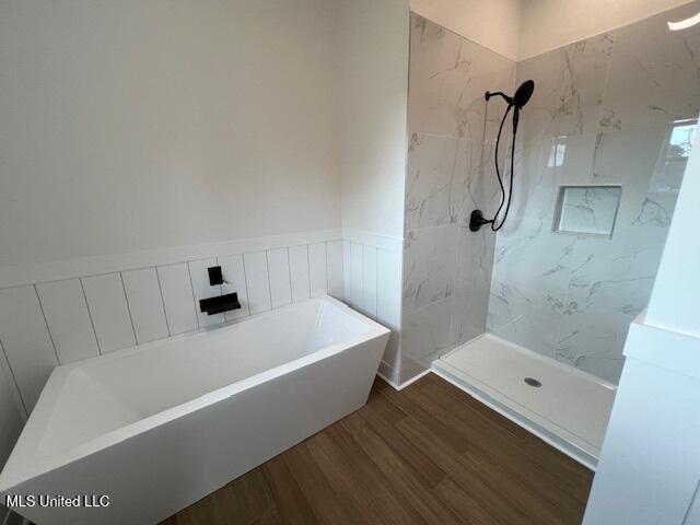 bathroom featuring hardwood / wood-style flooring and independent shower and bath