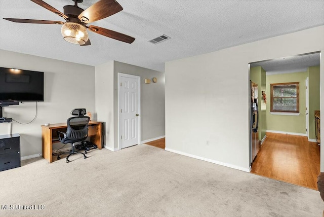 221 Highpoint Dr, Diamondhead, MS 39525 - home office featuring carpet flooring, ceiling fan, and a textured ceiling
