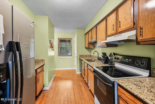 221 Highpoint Dr, Diamondhead, MS 39525 - kitchen with a textured ceiling, sink, electric range, stainless steel fridge with ice dispenser, and light hardwood / wood-style floors