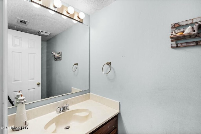 221 Highpoint Dr, Diamondhead, MS 39525 - bathroom featuring vanity and a textured ceiling