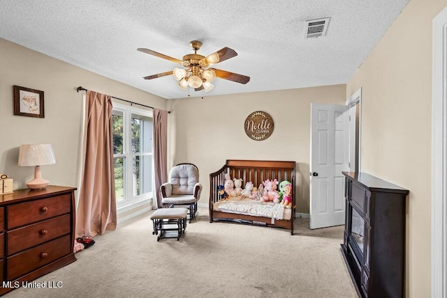 221 Highpoint Dr, Diamondhead, MS 39525 - bedroom featuring a textured ceiling, ceiling fan, and light carpet