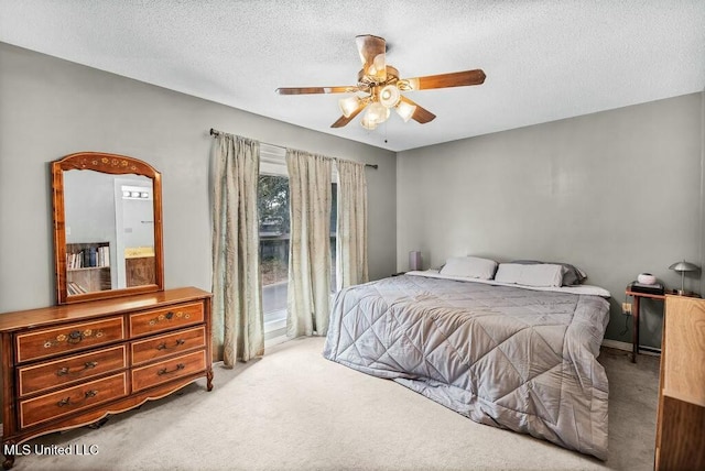 221 Highpoint Dr, Diamondhead, MS 39525 - bedroom with ceiling fan, light colored carpet, and a textured ceiling