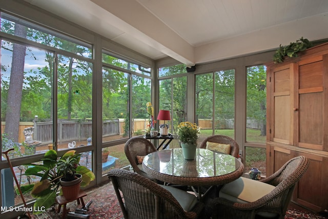 sunroom / solarium with beamed ceiling