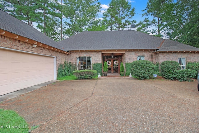 view of front facade with french doors and a garage