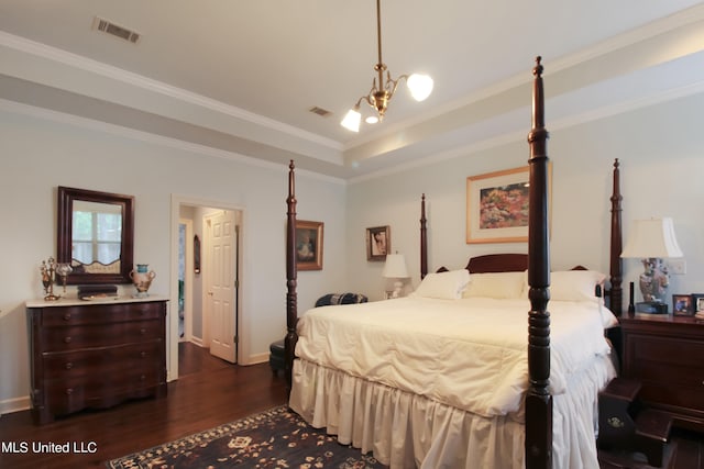 bedroom with crown molding, a raised ceiling, a chandelier, and dark hardwood / wood-style floors