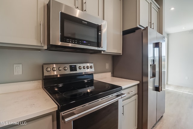 kitchen featuring stainless steel appliances and light wood-type flooring