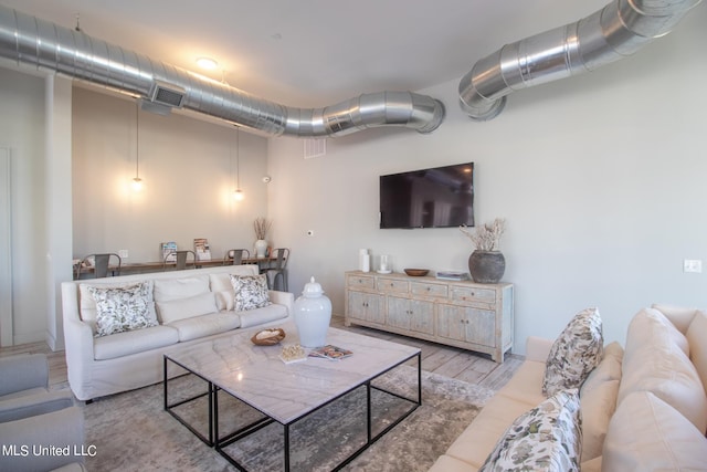 living room with light hardwood / wood-style floors