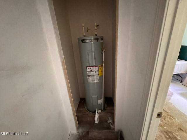 utility room featuring electric water heater