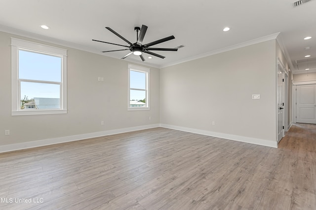 empty room featuring light hardwood / wood-style floors, ceiling fan, and ornamental molding