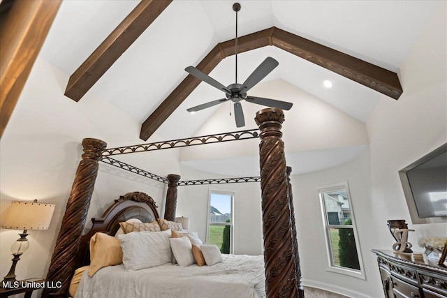 bedroom with beamed ceiling and high vaulted ceiling
