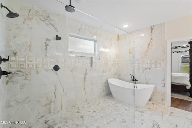ensuite bathroom featuring a healthy amount of sunlight, a freestanding bath, ensuite bathroom, and a marble finish shower