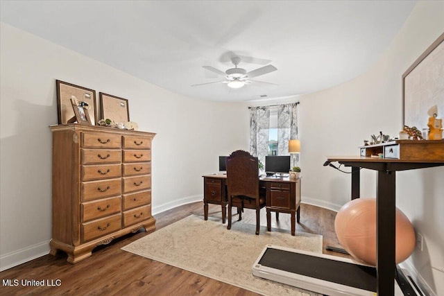 office with dark wood finished floors, baseboards, and ceiling fan