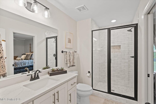 full bath with toilet, ensuite bath, visible vents, a shower stall, and vanity