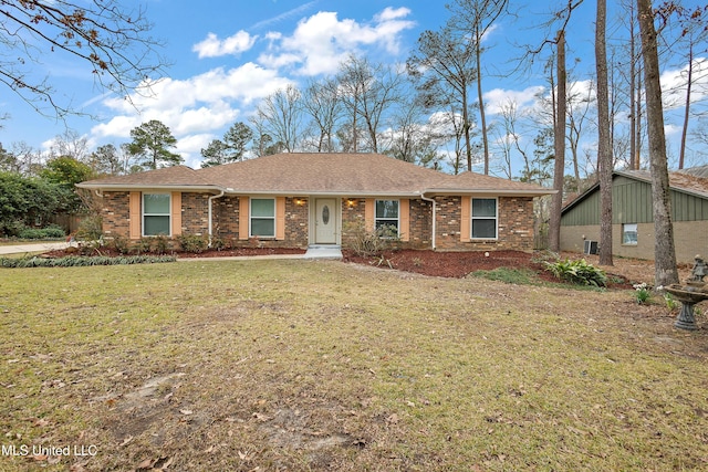 ranch-style home with a front lawn