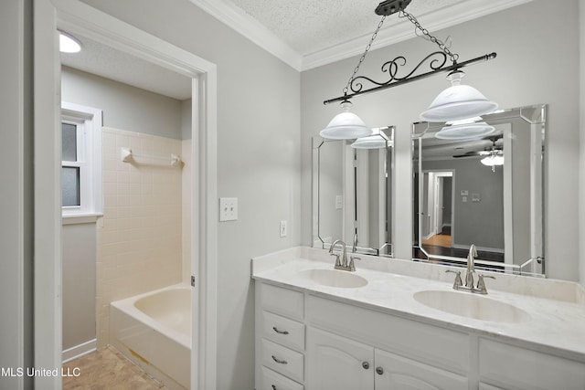 bathroom featuring shower / bath combination, ceiling fan, tile patterned floors, a textured ceiling, and vanity