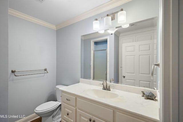 bathroom featuring toilet, vanity, ornamental molding, and an enclosed shower