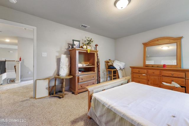 bedroom featuring visible vents and carpet floors