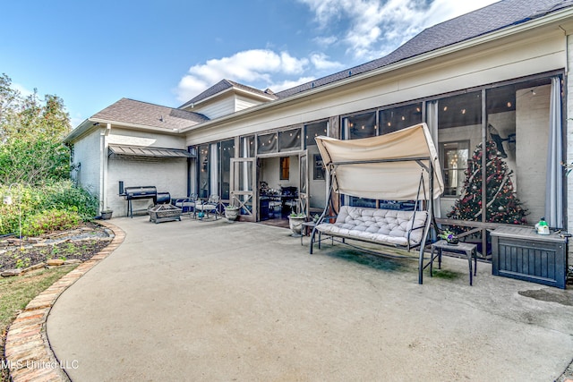 view of patio with a sunroom