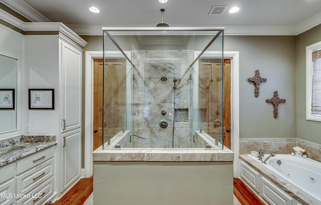 bathroom featuring hardwood / wood-style flooring, crown molding, and plus walk in shower