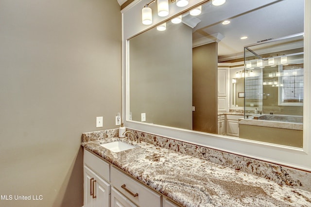 bathroom with vanity and crown molding