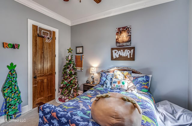 carpeted bedroom featuring ceiling fan and ornamental molding