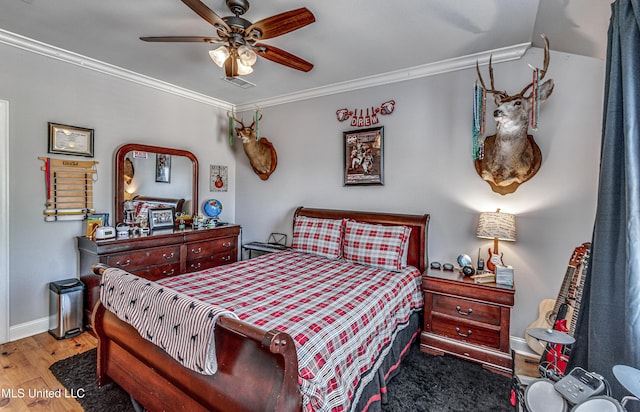 bedroom with ceiling fan, light hardwood / wood-style flooring, and crown molding