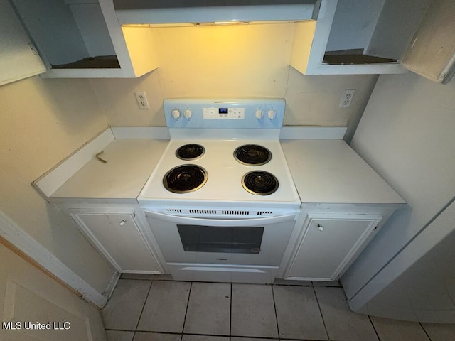 kitchen featuring light countertops and white range with electric cooktop