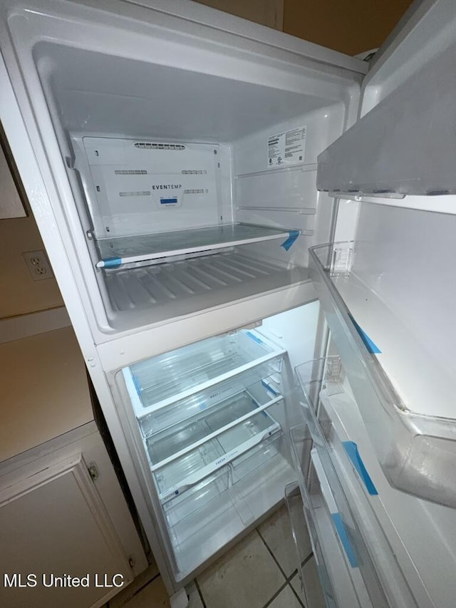 interior details featuring refrigerator